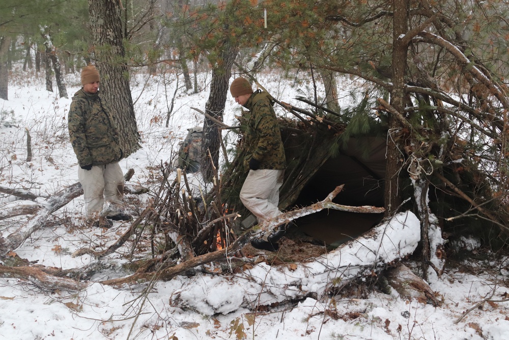 Improvised shelter building by Cold-Weather Operations Course students in Class 20-01