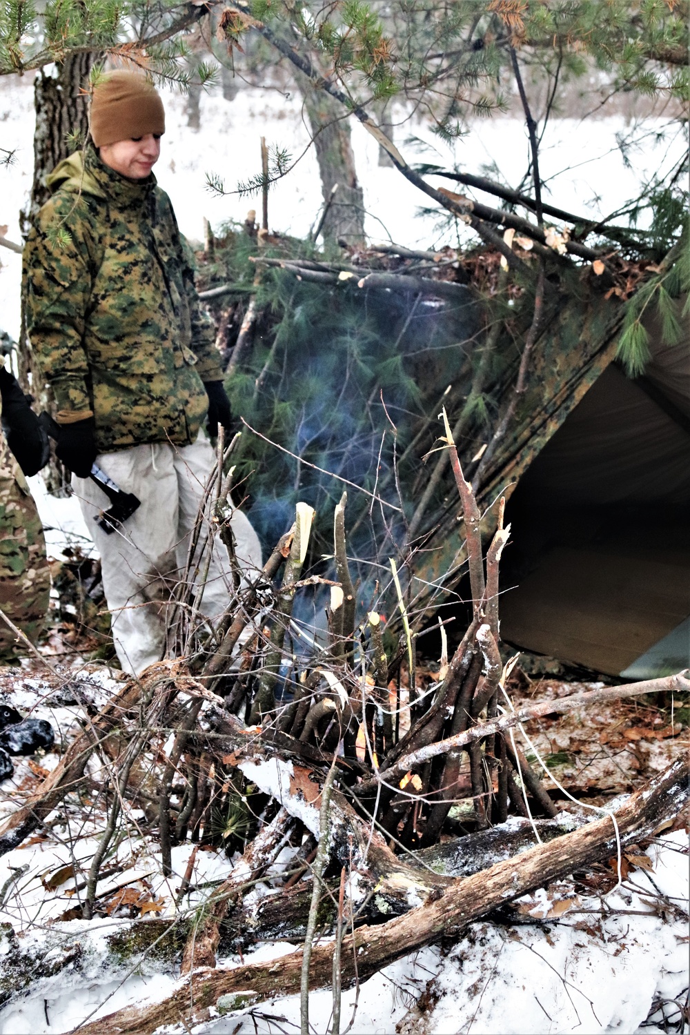 Improvised shelter building by Cold-Weather Operations Course students in Class 20-01