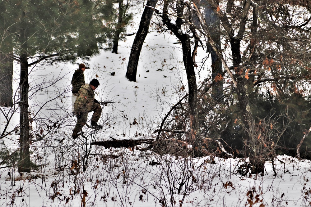 Improvised shelter building by Cold-Weather Operations Course students in Class 20-01