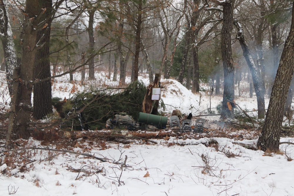 Improvised shelter building by Cold-Weather Operations Course students in Class 20-01