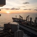 The fleet replenishment oiler USNS Walter S. Diehl (T-AO 193) sails alongside the aircraft carrier USS John C. Stennis (CVN 74)