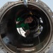 U.S. Sailor maintain a launching engine piston for a steam-powered catapult