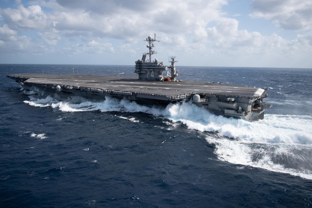 The aircraft carrier USS John C. Stennis (CVN 74) maneuvers in the Atlantic Ocean