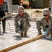 U.S. Navy Seabees deployed with NMCB-5’s Detail Palawan pour concrete at Malatgao Elementary School