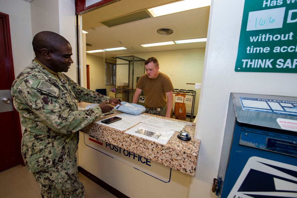 U.S. Navy Seabees deployed with NMCB-5 receive mail during the holidays