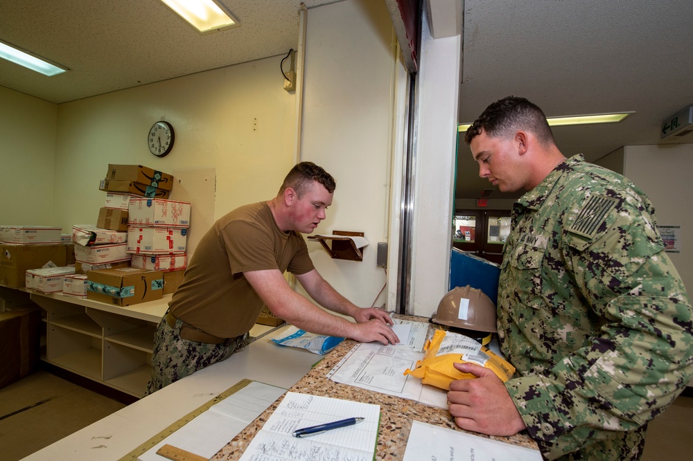 U.S. Navy Seabees deployed with NMCB-5 receive mail during the holidays