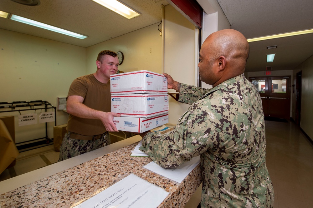 U.S. Navy Seabees deployed with NMCB-5 receive mail during the holidays