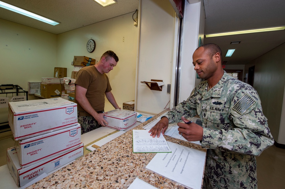 U.S. Navy Seabees deployed with NMCB-5 receive mail during the holidays