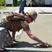 U.S. Navy Seabees from NMCB 5’s Detail Diego Garcia place concrete in support of the U.S. Air Force