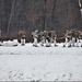 Fort McCoy Cold-Weather Operations Course students train in snowshoes pulling ahkio sled