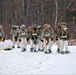 Fort McCoy Cold-Weather Operations Course students train in snowshoes pulling ahkio sled