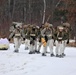 Fort McCoy Cold-Weather Operations Course students train in snowshoes pulling ahkio sled