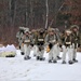 Fort McCoy Cold-Weather Operations Course students train in snowshoes pulling ahkio sled