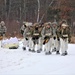 Fort McCoy Cold-Weather Operations Course students train in snowshoes pulling ahkio sled