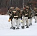 Fort McCoy Cold-Weather Operations Course students train in snowshoes pulling ahkio sled