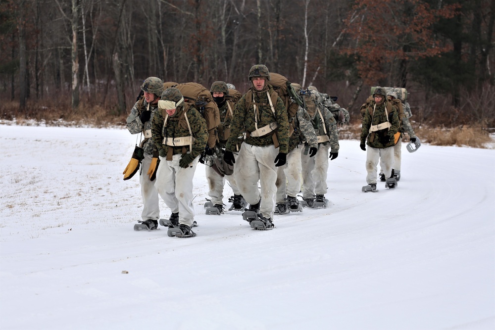 Fort McCoy Cold-Weather Operations Course students train in snowshoes pulling ahkio sled