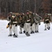 Fort McCoy Cold-Weather Operations Course students train in snowshoes pulling ahkio sled