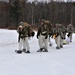 Fort McCoy Cold-Weather Operations Course students train in snowshoes pulling ahkio sled