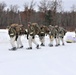 Fort McCoy Cold-Weather Operations Course students train in snowshoes pulling ahkio sled