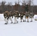 Fort McCoy Cold-Weather Operations Course students train in snowshoes pulling ahkio sled