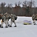 Fort McCoy Cold-Weather Operations Course students train in snowshoes pulling ahkio sled