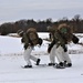 Fort McCoy Cold-Weather Operations Course students train in snowshoes pulling ahkio sled