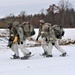 Fort McCoy Cold-Weather Operations Course students train in snowshoes pulling ahkio sled