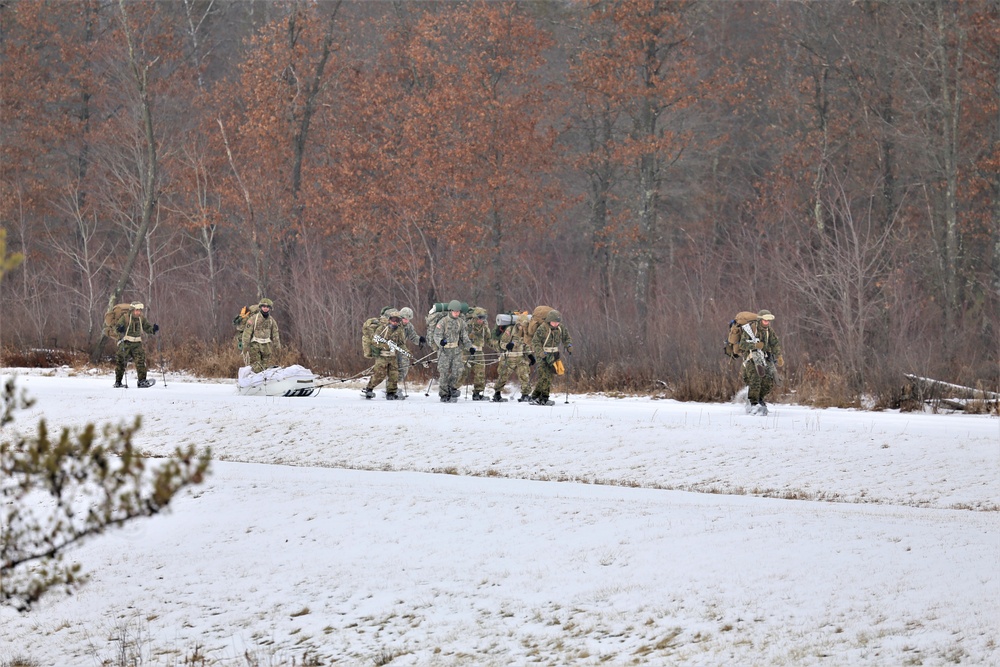 Fort McCoy Cold-Weather Operations Course students train in snowshoes pulling ahkio sled