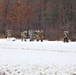 Fort McCoy Cold-Weather Operations Course students train in snowshoes pulling ahkio sled