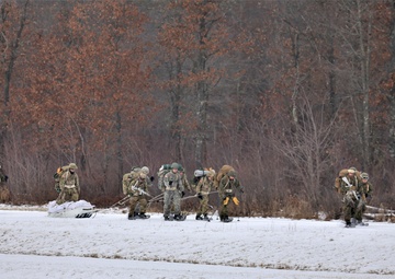 Photo Essay: Fort McCoy Cold-Weather Operations Course students train in snowshoes pulling ahkio sled