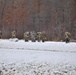 Fort McCoy Cold-Weather Operations Course students train in snowshoes pulling ahkio sled