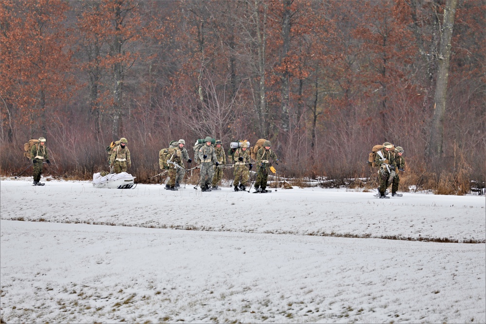 Fort McCoy Cold-Weather Operations Course students train in snowshoes pulling ahkio sled