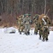 Fort McCoy Cold-Weather Operations Course students train in snowshoes pulling ahkio sled