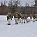 Fort McCoy Cold-Weather Operations Course students train in snowshoes pulling ahkio sled