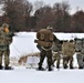 Fort McCoy Cold-Weather Operations Course students train in snowshoes pulling ahkio sled