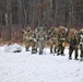 Fort McCoy Cold-Weather Operations Course students train in snowshoes pulling ahkio sled