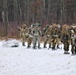 Fort McCoy Cold-Weather Operations Course students train in snowshoes pulling ahkio sled