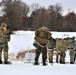 Fort McCoy Cold-Weather Operations Course students train in snowshoes pulling ahkio sled