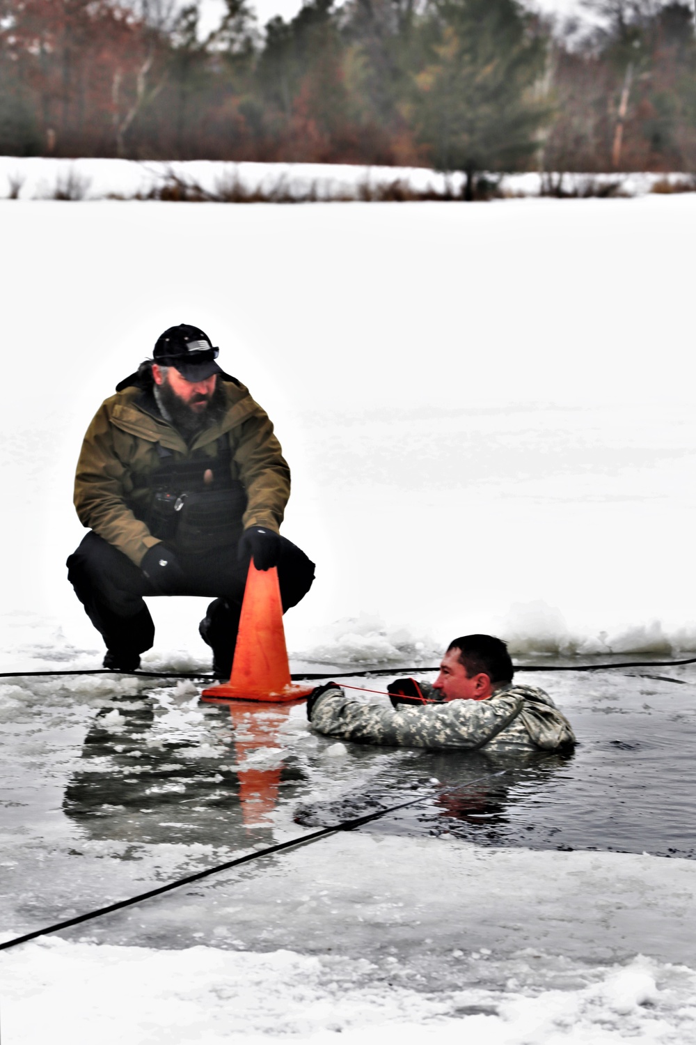 Cold-Weather Operations Course students participate in cold-water immersion training