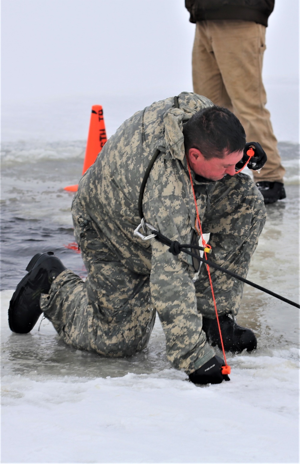 Cold-Weather Operations Course students participate in cold-water immersion training