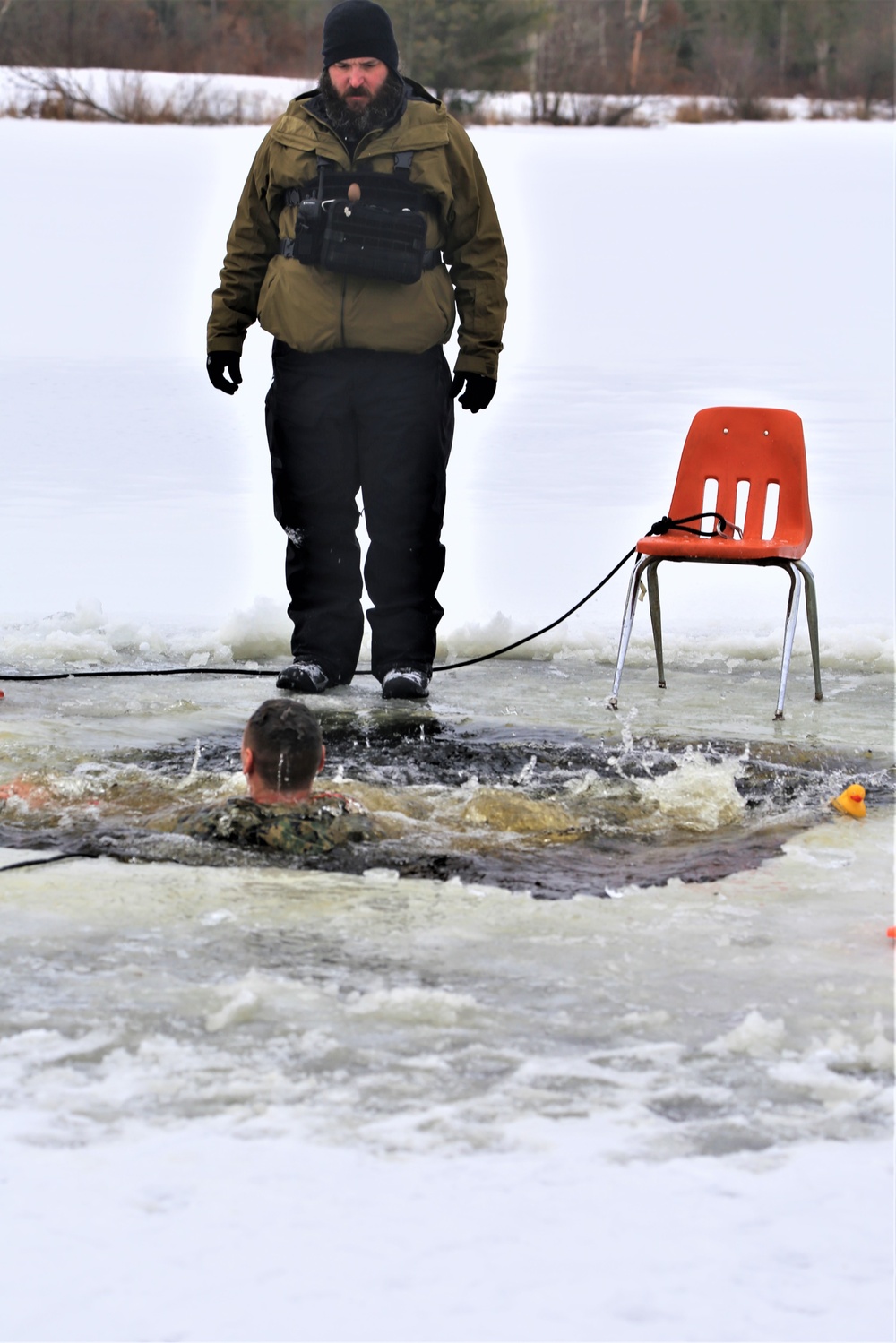 Cold-Weather Operations Course students participate in cold-water immersion training