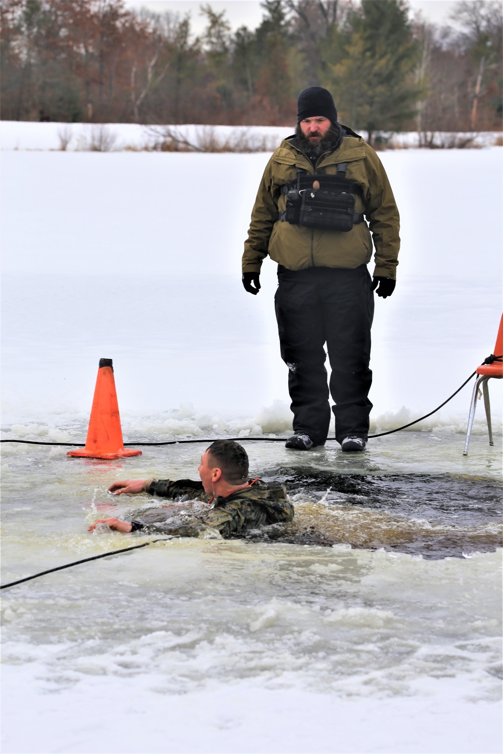 Cold-Weather Operations Course students participate in cold-water immersion training