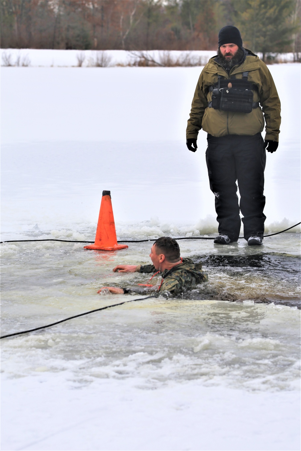 Cold-Weather Operations Course students participate in cold-water immersion training