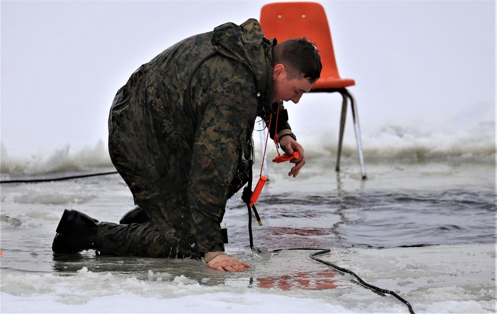 Cold-Weather Operations Course students participate in cold-water immersion training