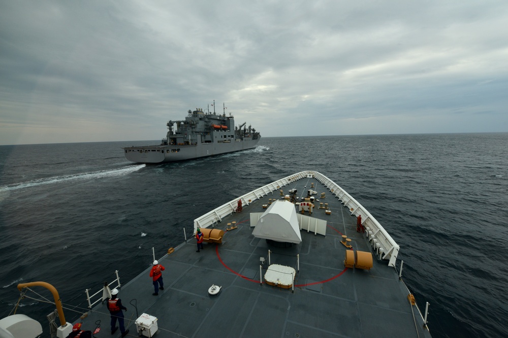 U.S. Coast Guard Cutter Bertholf conducts underway replenishment with the USNS Amelia Earhart in the East China Sea