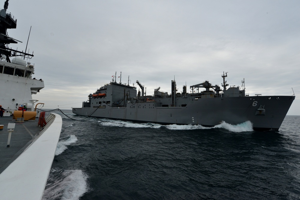 U.S. Coast Guard Cutter Bertholf conducts underway replenishment with the USNS Amelia Earhart in the East China Sea