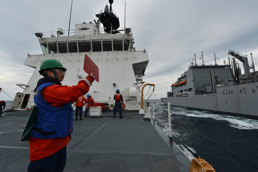 U.S. Coast Guard Cutter Bertholf conducts underway replenishment with the USNS Amelia Earhart in the East China Sea