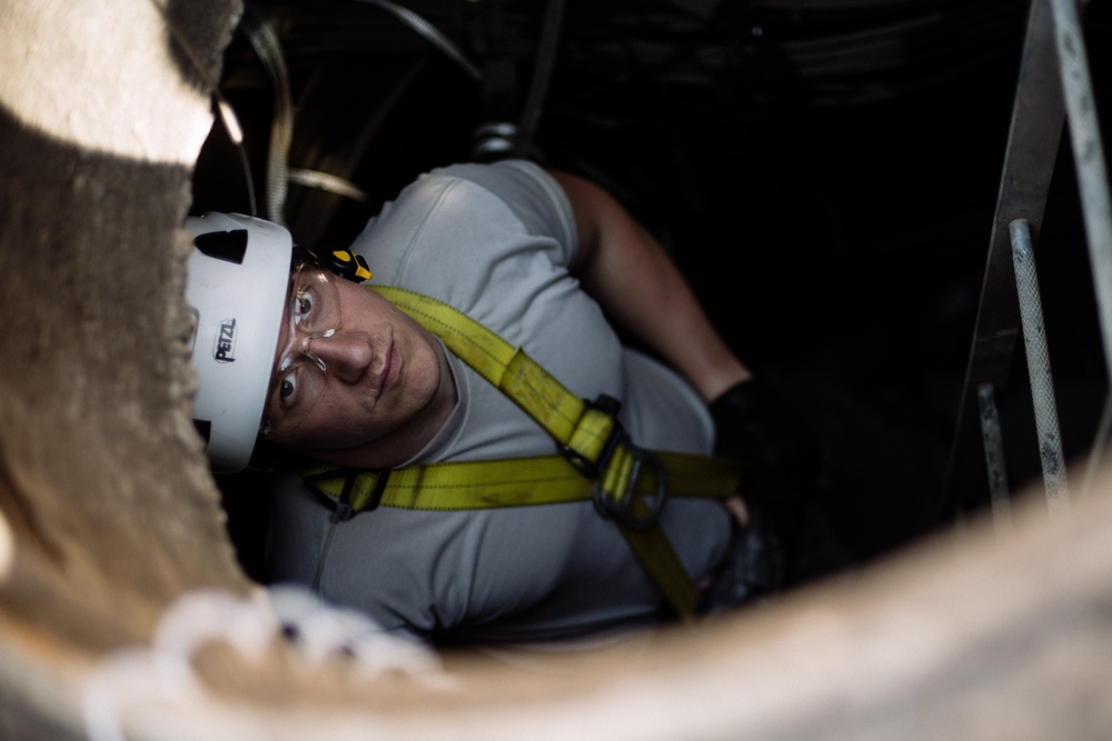 Airmen assigned to the 205th Engineering and Installation Squadron (205th EIS) at Will Rogers Air National Guard Base in Oklahoma City, install fiber optic cables underneath Wyoming Air National Guard Base in Cheyenne, Wyo.