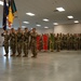 55th Maneuver Enhancement Brigade Command Sgt. Major passes the colors to the next Command Sgt. Major