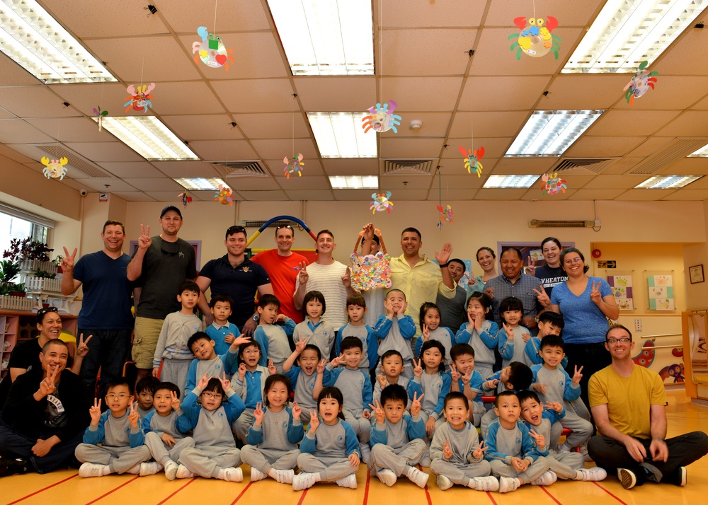 U.S. Coast Guard Cutter Bertholf crew members volunteer at Hong Kong nursery school